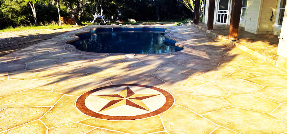 Fiberglass Pools San Antonio by Lonestar swimming pool installation concrete deck overlay and flagstone custom coping, stacked rock water fall feature