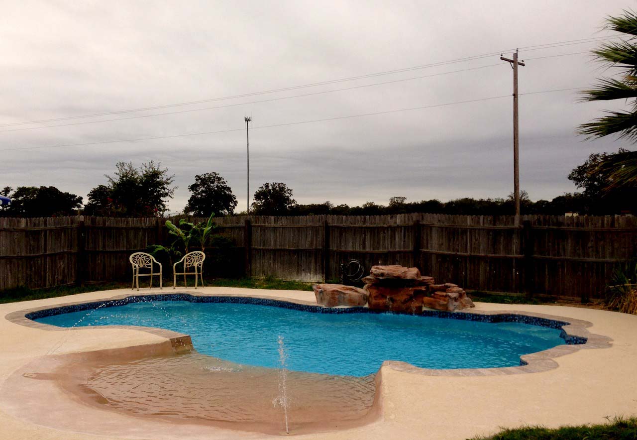 Lonestar Fiberglass Pools St Hedwig Texas for a private backyard oasis and staycation without the hassle of packing to leave town