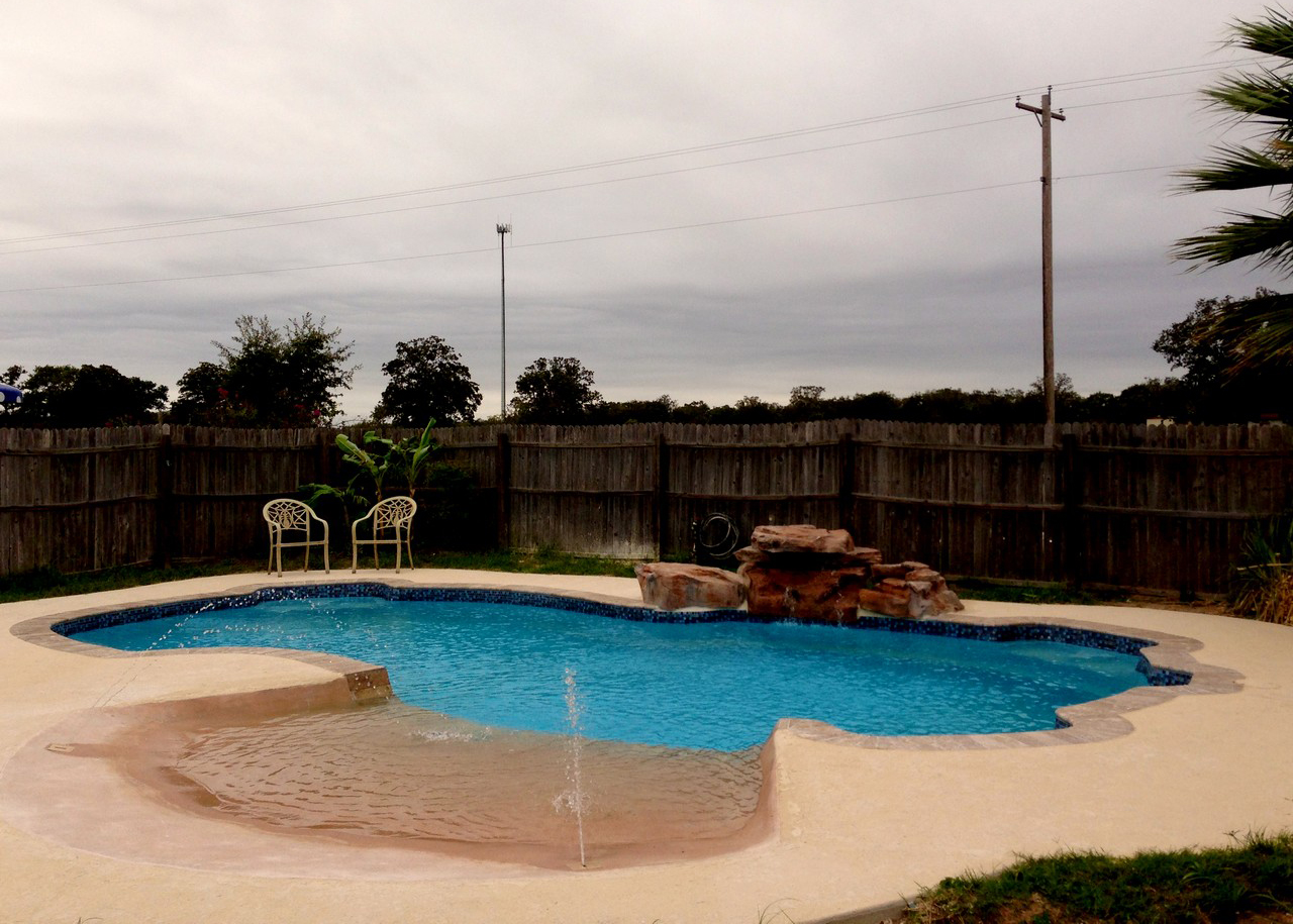 Lonestar Fiberglass Swimming Pools Poteet Texas private backyard oasis and staycation without the hassle of leaving town for an Airbnb