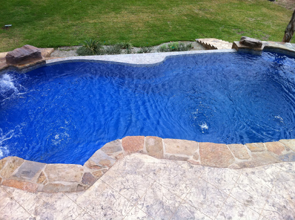 Negative Edge Lonestar Fiberglass Pools Seguin Texas installation guide for a properly installed inground pool for your private backyard oasis