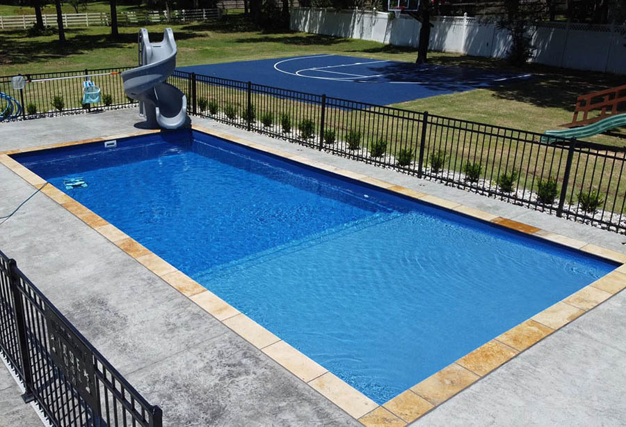 Lonestar Inground Fiberglass Pools Conroe private backyard oasis for a staycation vacation without the hassle